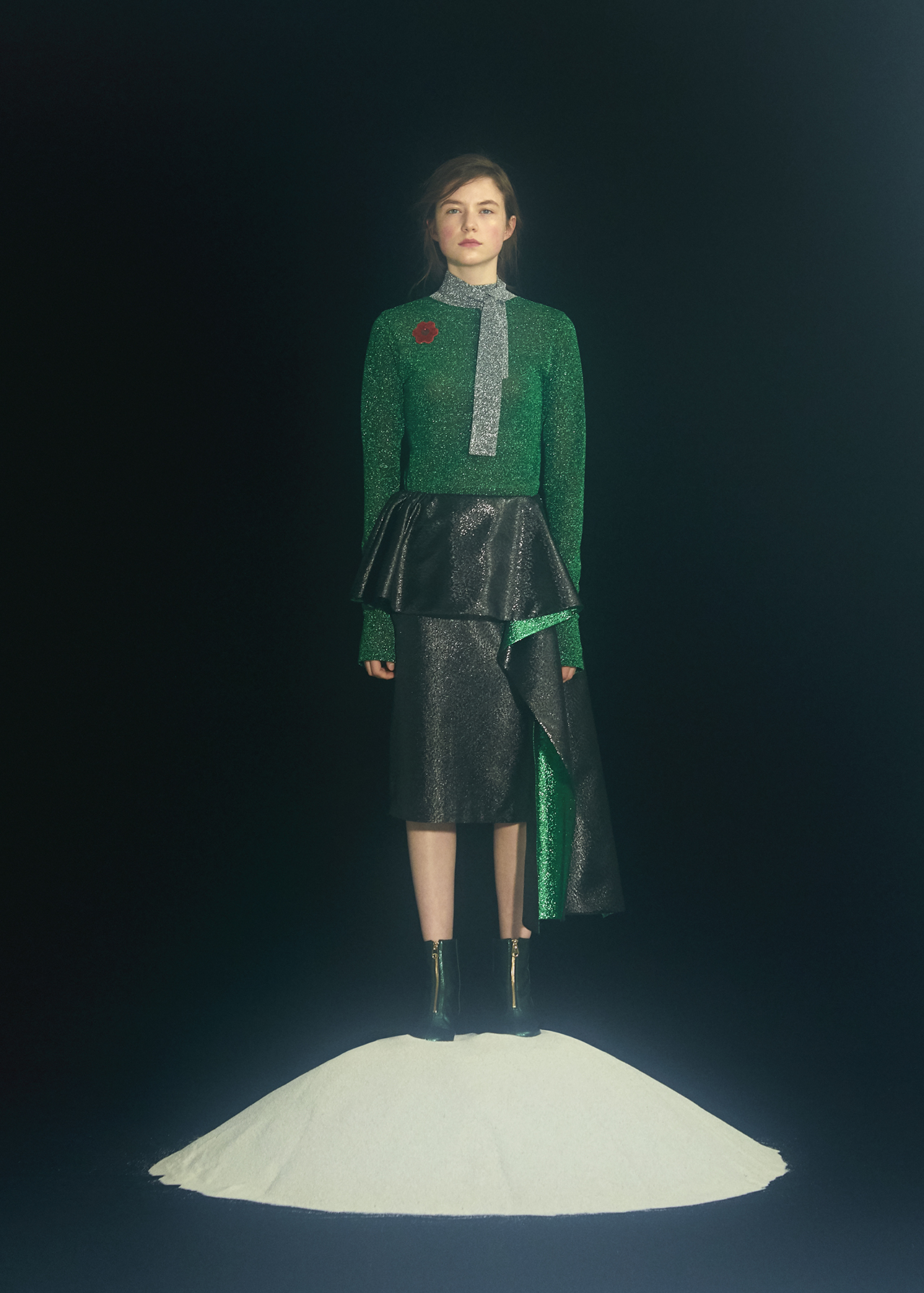 One of Minju Kim's designs Woman wearing a gliterry green and black ensemble